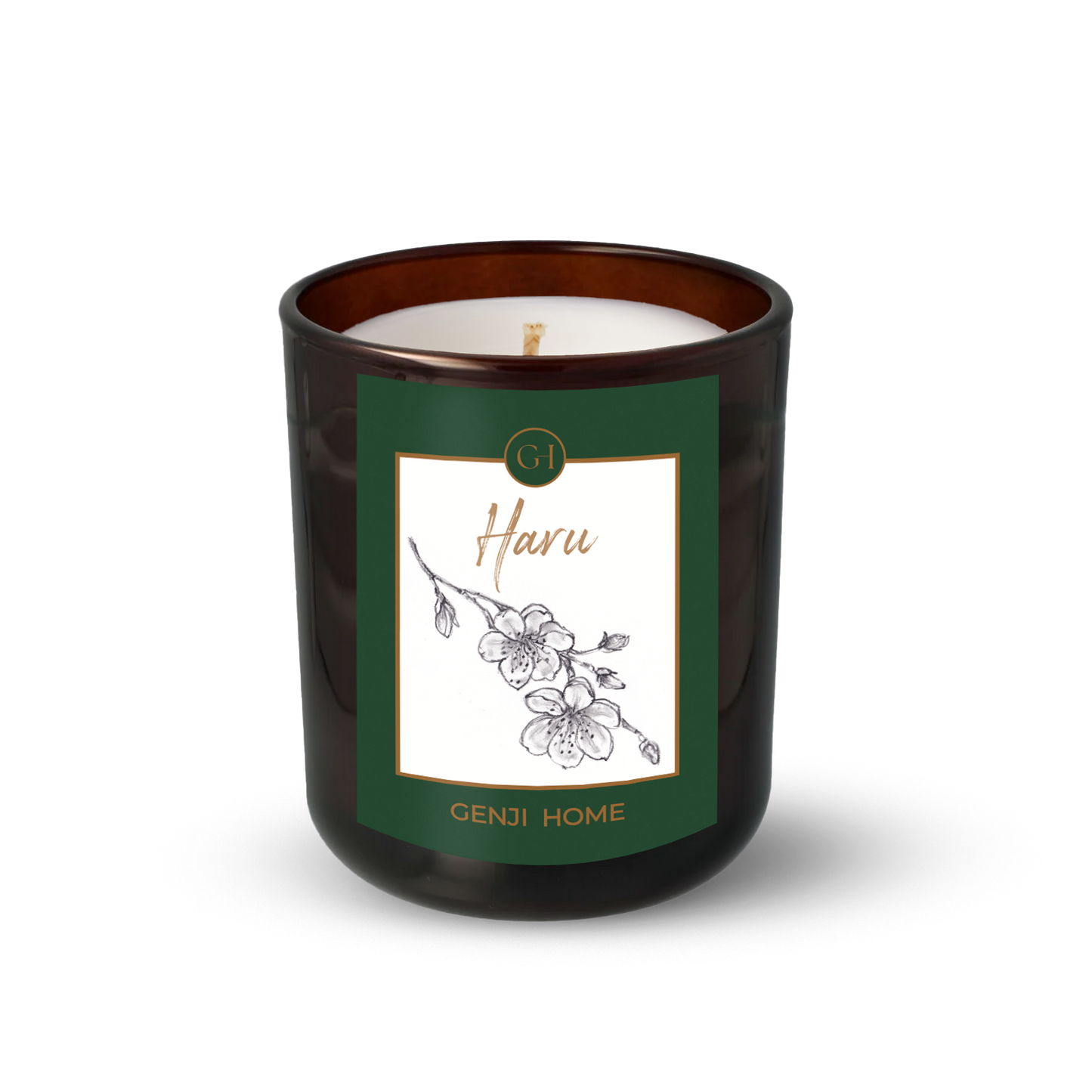 Haru Olive Wax Candle by Genji Home in a amber glass container with a green label featuring 'Genji Home' branding.