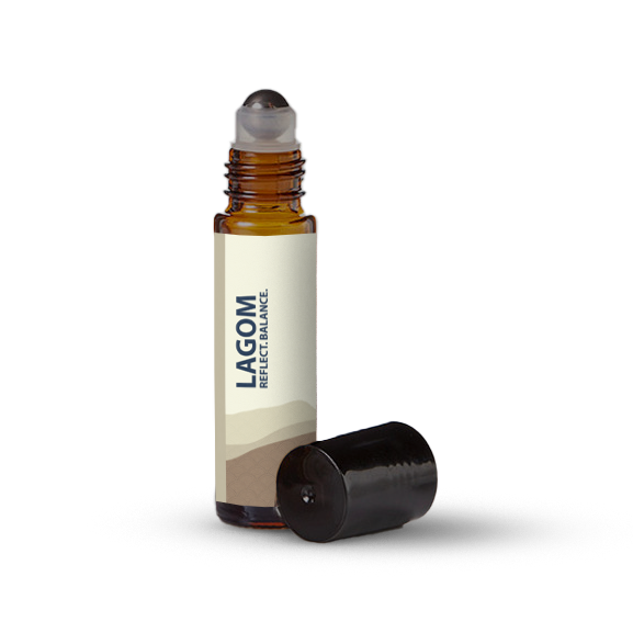 Lagom essential oil roller bottle on a transparent background.