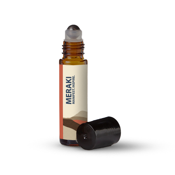 Meraki essential oil roller bottle on a transparent background.