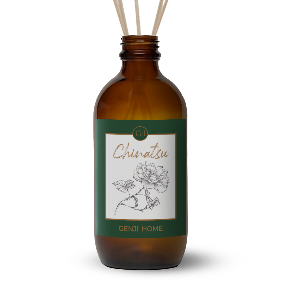 Brown diffuser bottle with green label featuring a rose illustration and 'Genji Home' branding on a transparent background.