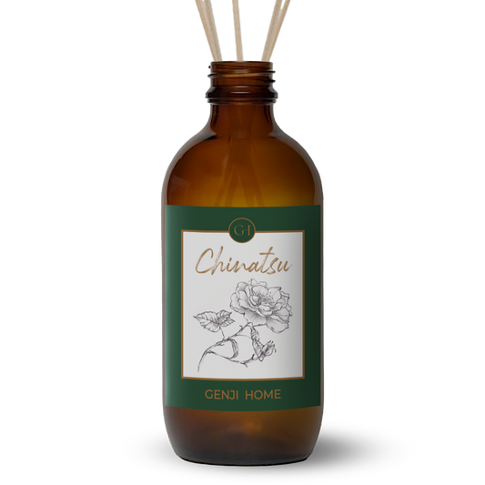 Brown diffuser bottle with green label featuring a rose illustration and 'Genji Home' branding on a transparent background.