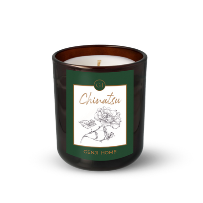 Chinatsu Olive Wax Candle by Genji Home  in a amber glass container with a green label featuring 'Genji Home' branding.