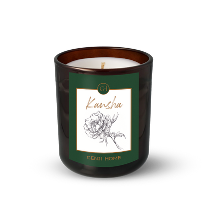 Kansha Olive Wax Candle by Genji Home  in a amber glass container with a green label featuring 'Genji Home' branding.