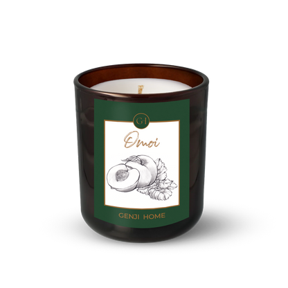 Omoi Olive Wax Candle by Genji Home  in a amber glass container with a green label featuring 'Genji Home' branding.