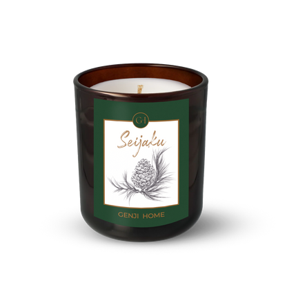 Seijaku Olive Wax Candle by Genji Home  in a amber glass container with a green label featuring 'Genji Home' branding.