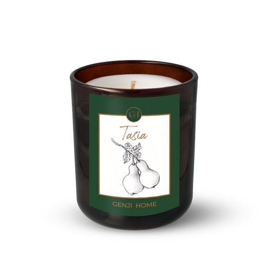 Tasia Olive Wax Candle by Genji Home  in a amber glass container with a green label featuring 'Genji Home' branding.