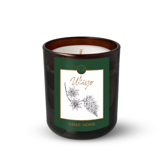 Ukiyo Olive Wax Candle by Genji Home  in a amber glass container with a green label featuring 'Genji Home' branding.