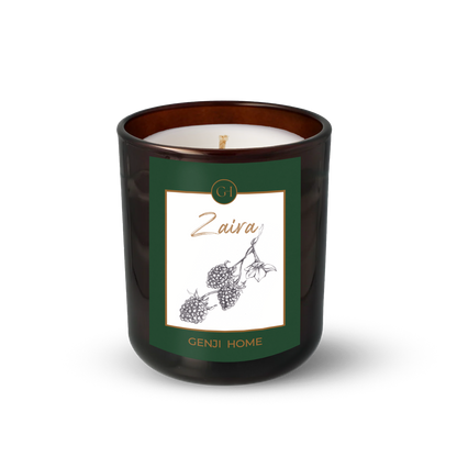 Zaira Olive Wax Candle by Genji Home  in a amber glass container with a green label featuring 'Genji Home' branding.