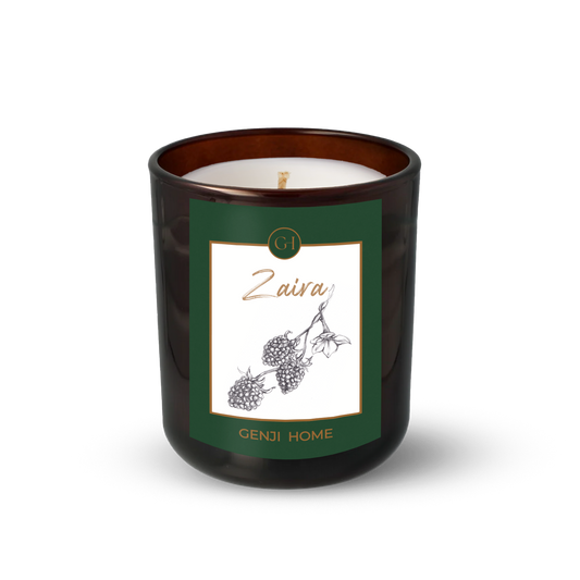 Zaira Olive Wax Candle by Genji Home  in a amber glass container with a green label featuring 'Genji Home' branding.