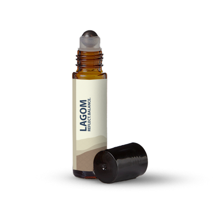 Lagom essential oil roller bottle on a transparent background.