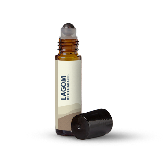 Lagom essential oil roller bottle on a transparent background.