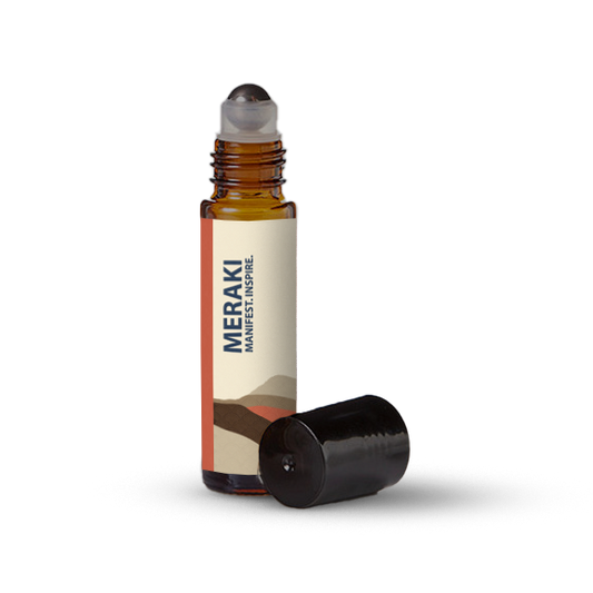Meraki essential oil roller bottle on a transparent background.