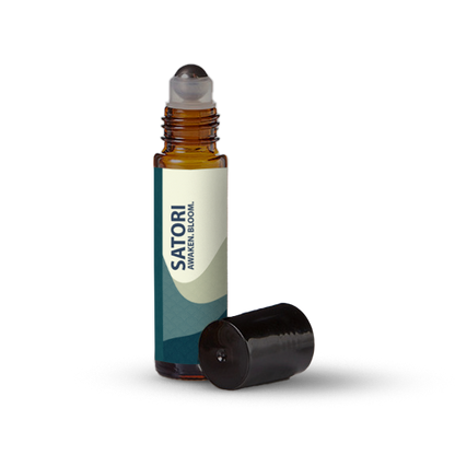 Satori essential oil roller bottle on a transparent background.